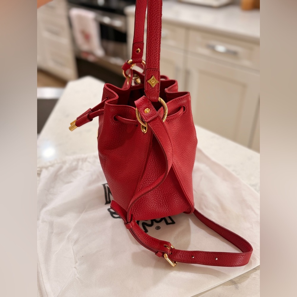 MCM Red Leather Bucket Bag
Crossbody Drawstring Gold Hardware - Picture 16 of 17